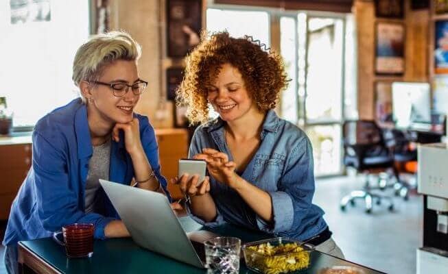 Woman opens an online checking account on her mobile device.
