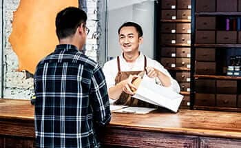 Merchant packages items after customer uses Samsung Pay.