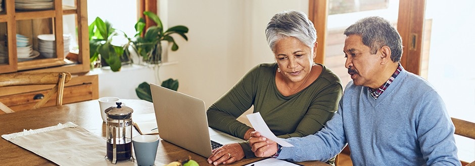 Couple looking to purchase a home discussing the difference between mortgage prequalification and mortgage preapproval